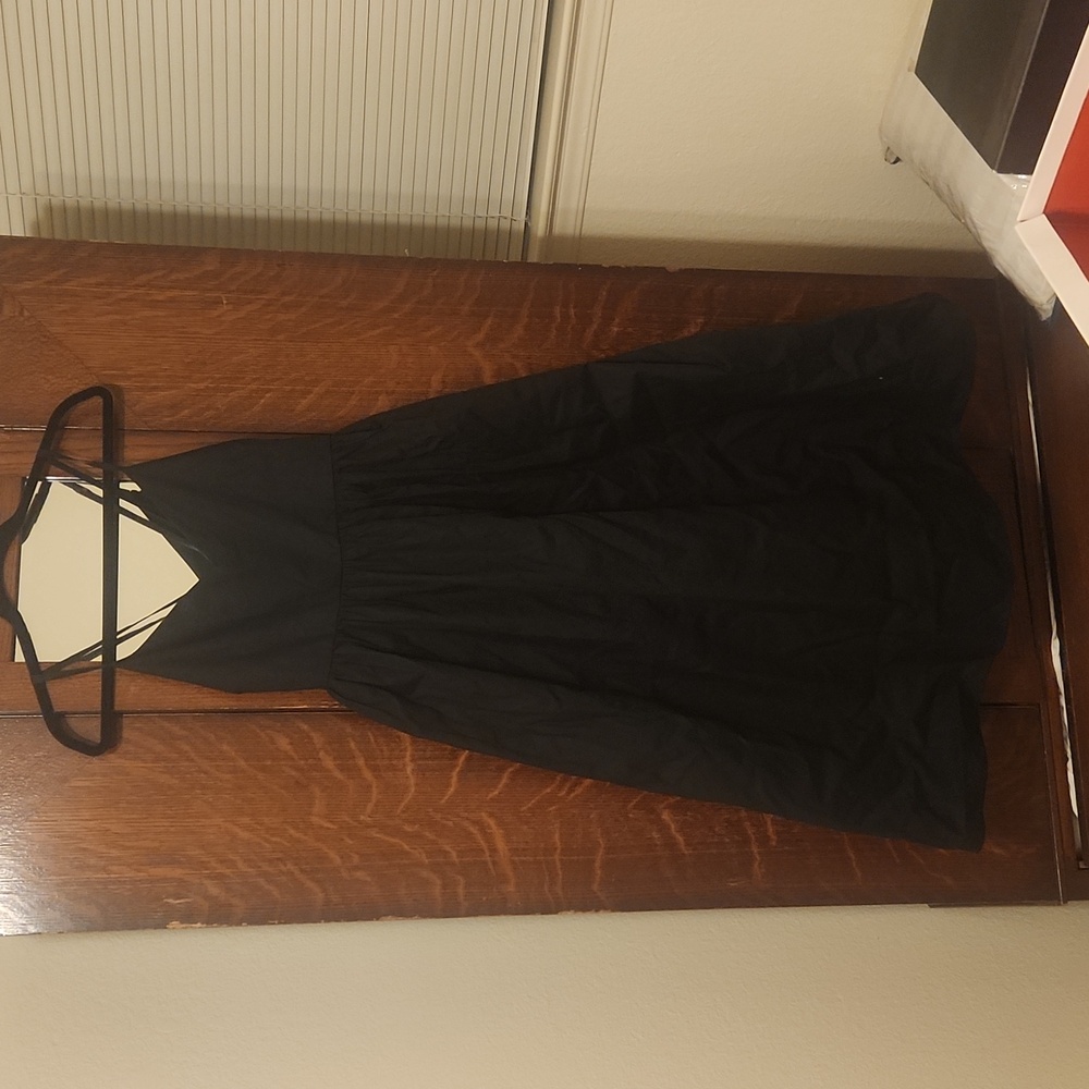 Beautiful mid length, deep V back, dress with empire bodess